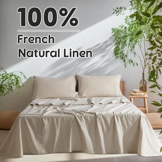 Bed with 100% French Natural Linen bedding in a bright room with plants.
