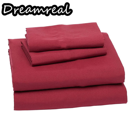 Red bed sheets set with 'Dreamreal' branding on a white background