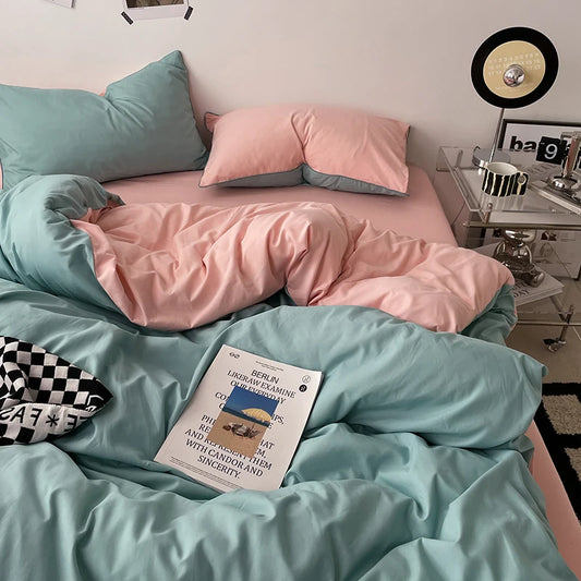 Bed with pink and teal bedding, a book titled 'Berlin' on the bed, and a nightstand with decorative items.