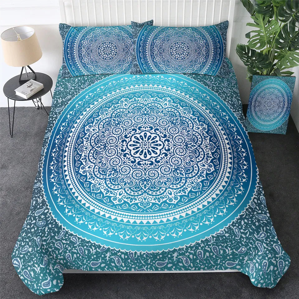 Blue and white mandala patterned bedding set on a bed in a bedroom setting.