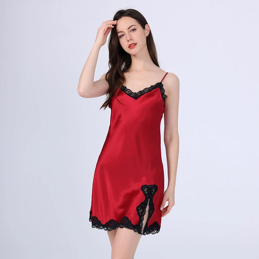 Red satin nightgown with black lace trim on a white background