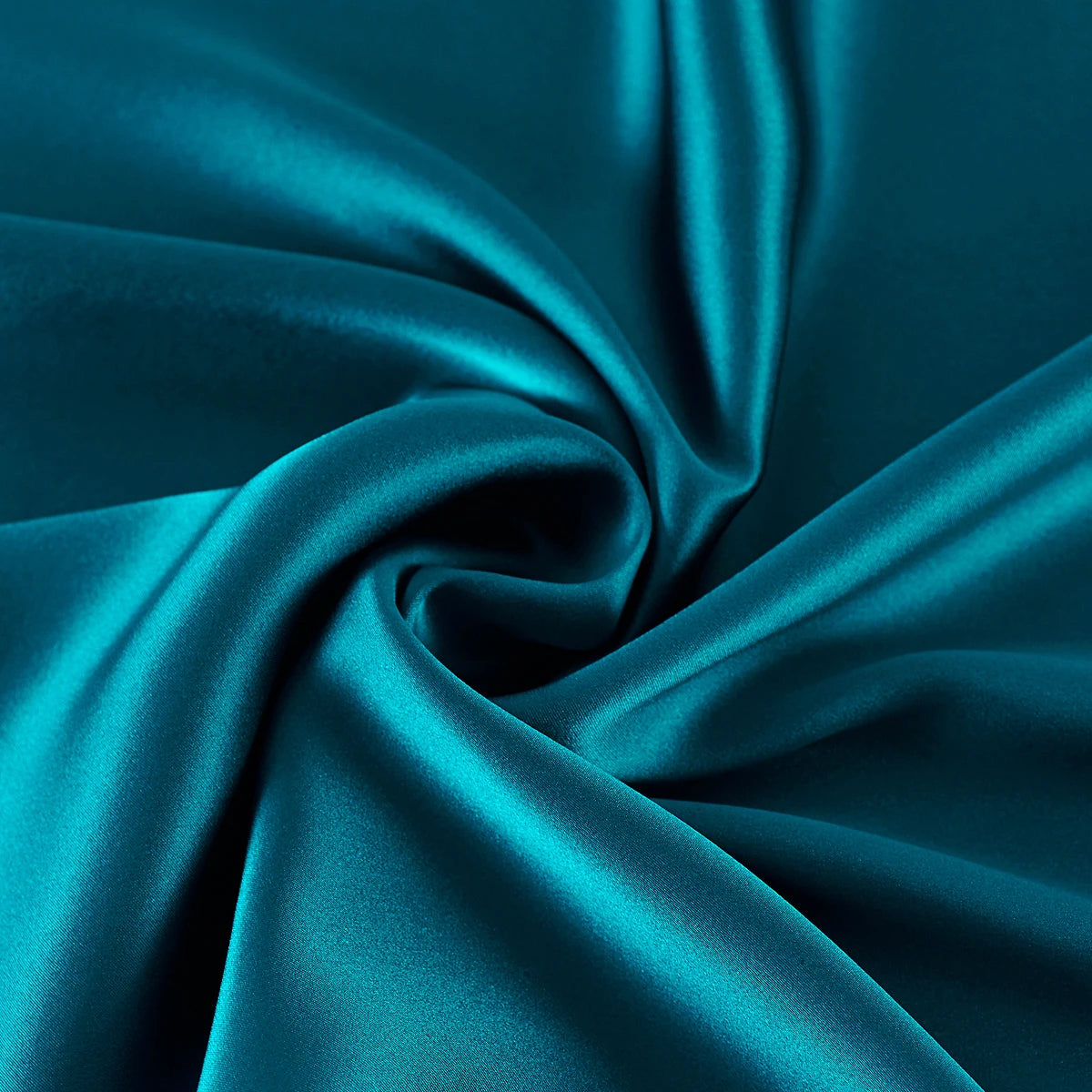 Close-up of teal fabric with folds