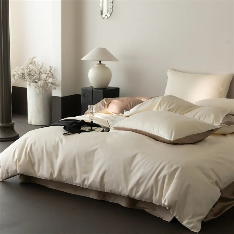 Neatly made bed with white bedding in a modern bedroom setting.