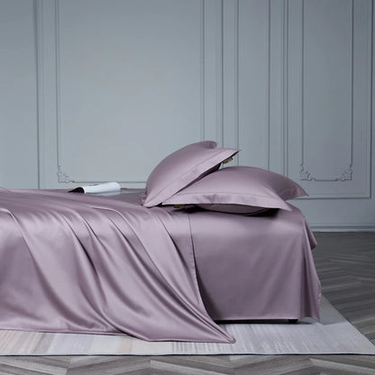 Purple satin bedding set on a bed with a neutral background