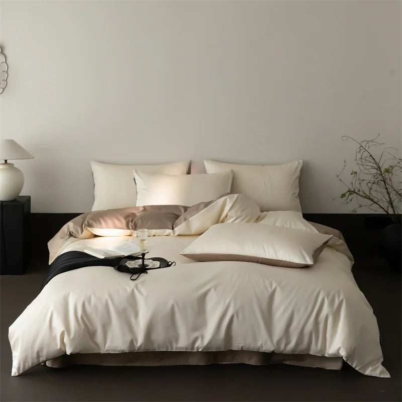 Neatly made bed with white bedding and pillows in a minimalistic bedroom setting.