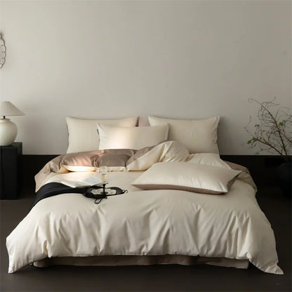 Neatly made bed with white bedding and pillows in a minimalistic bedroom setting.