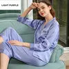 Woman wearing a light blue pajama set with a white background