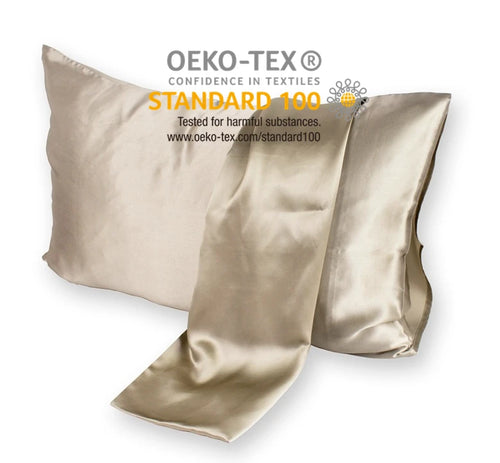 Gold satin pillowcases with OEKO-TEX certification on a white background
