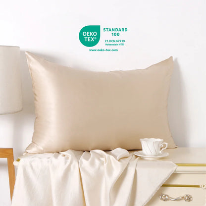 Beige pillow on a bed with a cup and saucer, featuring Oeko-Tex certification.
