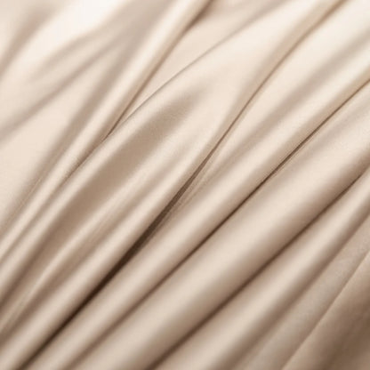 Close-up of beige fabric with folds