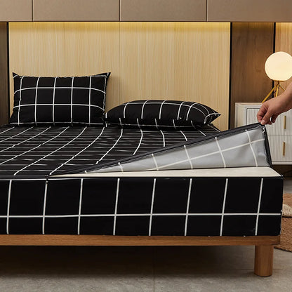 Bedding set with black and white grid pattern on a bed in a bedroom setting.