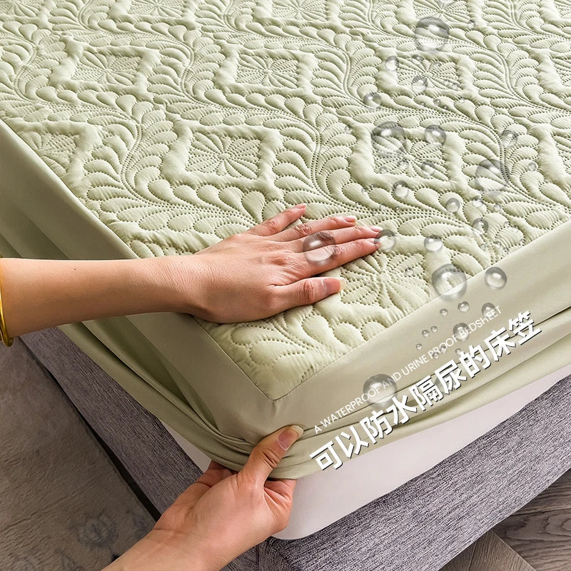 Person holding a waterproof mattress cover with embossed pattern