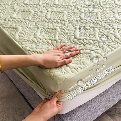 Person holding a waterproof mattress cover with embossed pattern