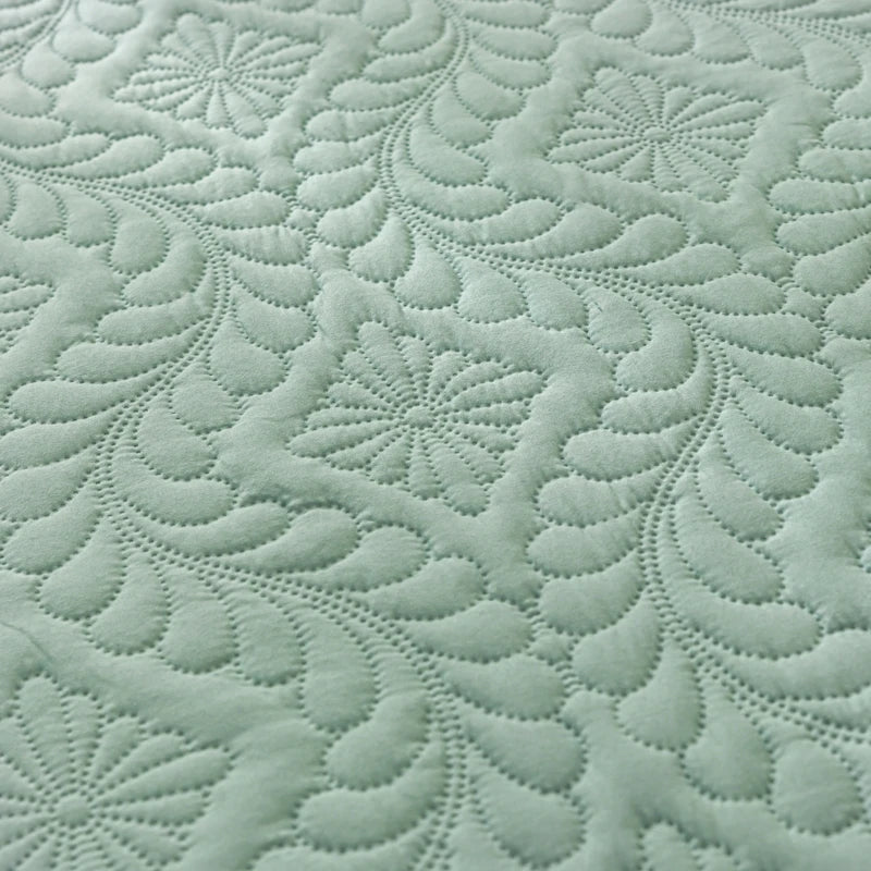 Close-up of textured green fabric with a pattern