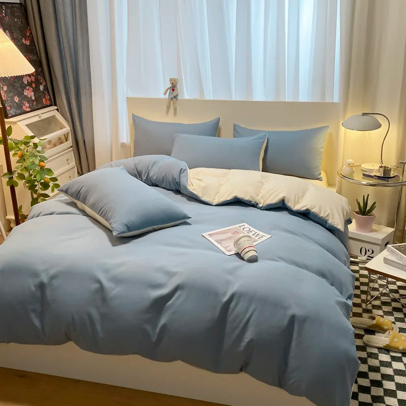 Bedroom with light blue bedding and decor elements.