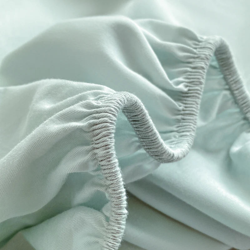 Close-up of light green fabric with textured edge