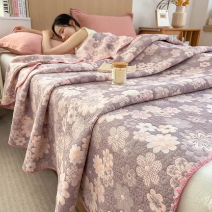Woman sleeping on a bed with floral-patterned bedding in a cozy bedroom setting.