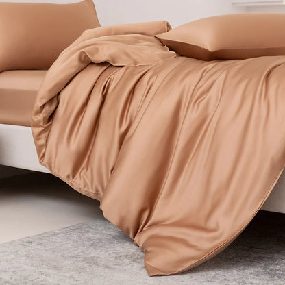 Brown comforter on a bed with pillows in a minimalistic room.