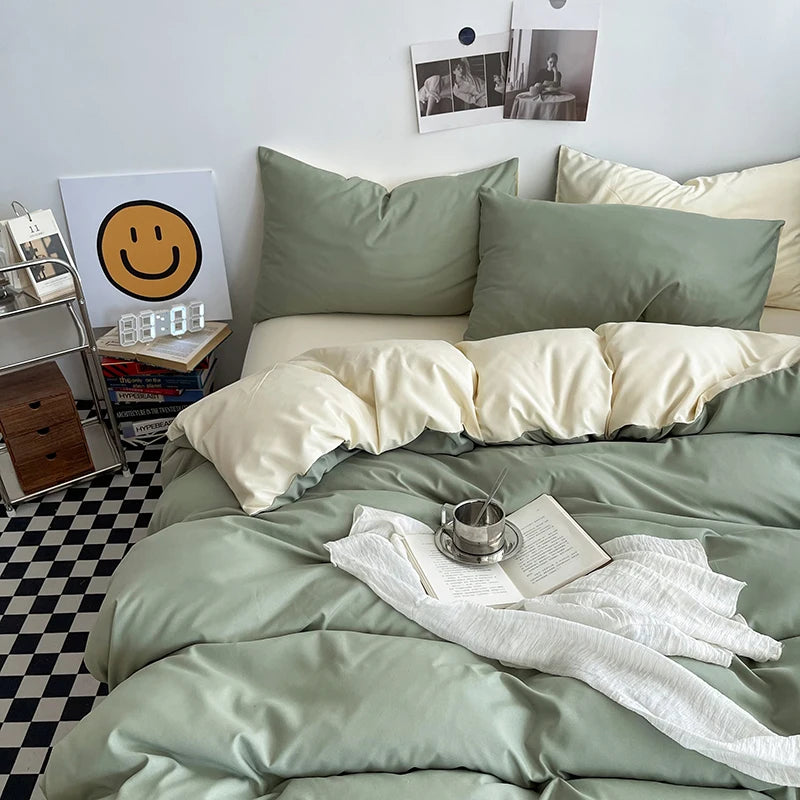 Bedroom with green bedding and pillows, checkered floor, and wall art.