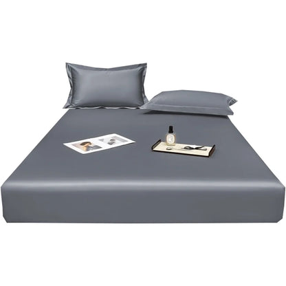 Gray bed sheet set with pillowcases on a white background