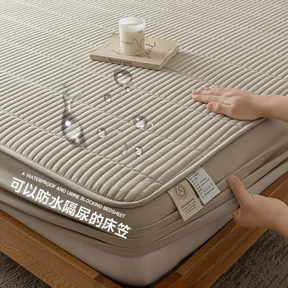 Beige waterproof bedsheet with a hand touching it, showing its texture and design.