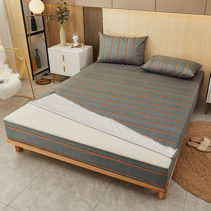 Bed with striped mattress cover in a bedroom setting
