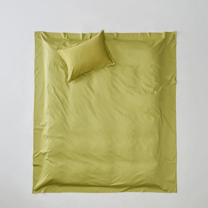 Green bedding set with a duvet and pillow on a light gray background