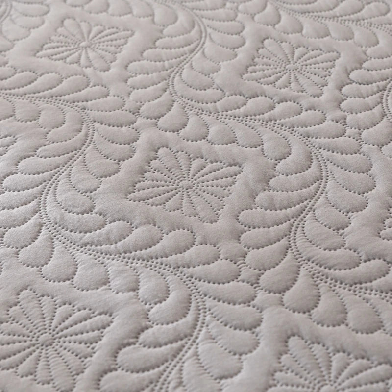 Close-up of textured gray fabric with floral pattern