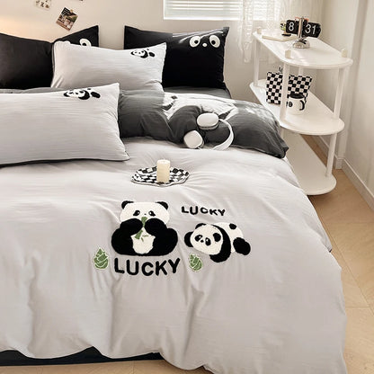 Bedding set with panda design and 'Lucky' text in a bedroom setting.