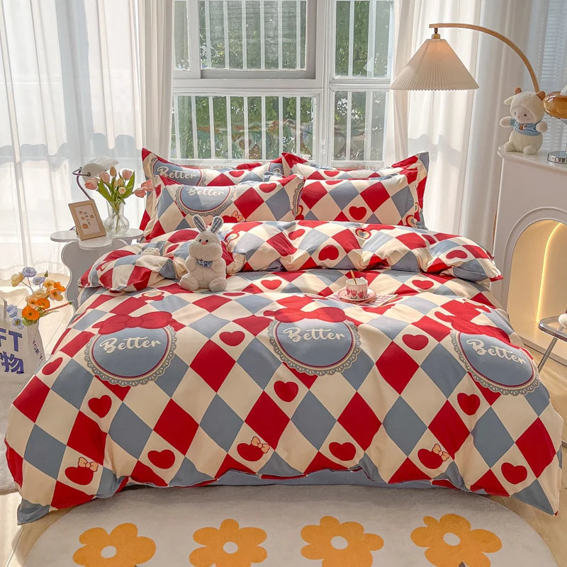 Bedding set with red, blue, and beige checkered pattern on a bed in a bright room.