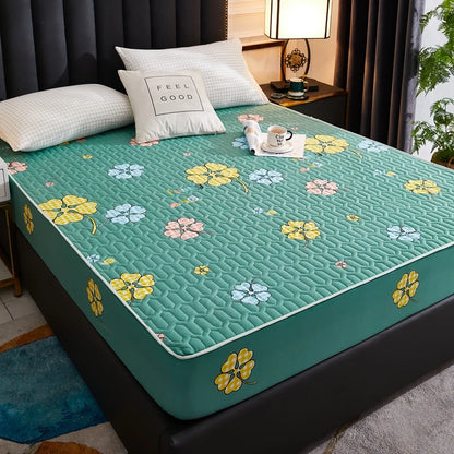 Floral patterned mattress cover on a bed in a bedroom setting