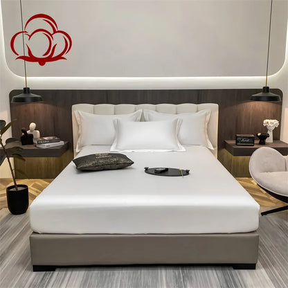 Modern bedroom with a bed, nightstands, and decorative elements.