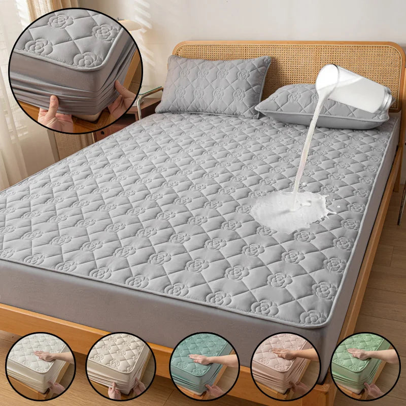 Gray quilted mattress cover on a bed with close-up insets showing different color options.