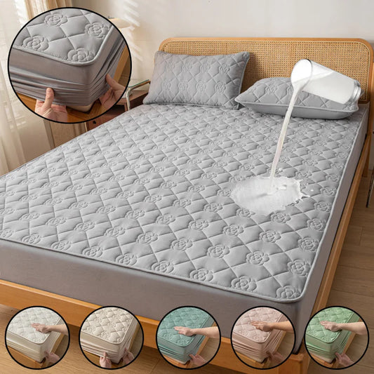 Gray quilted mattress cover on a bed with close-up insets showing different color options.