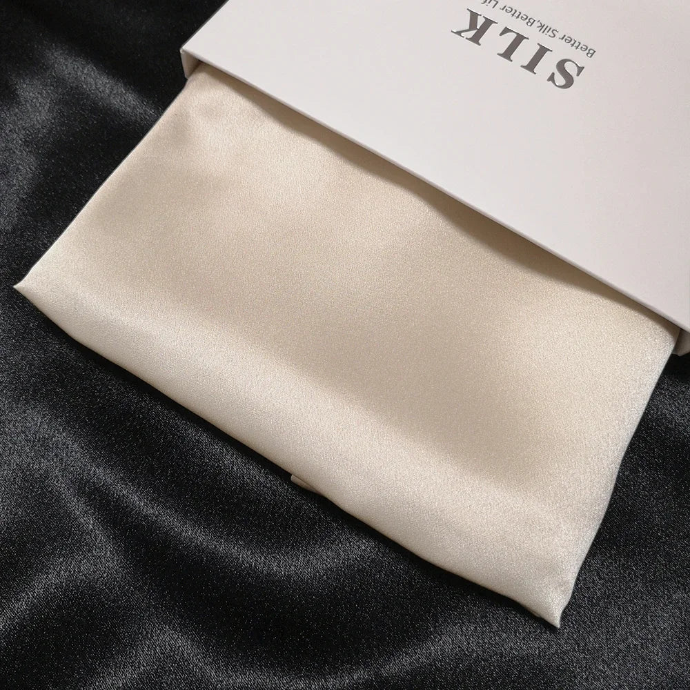 Beige silk fabric on a black background with 'Silk' branding visible.