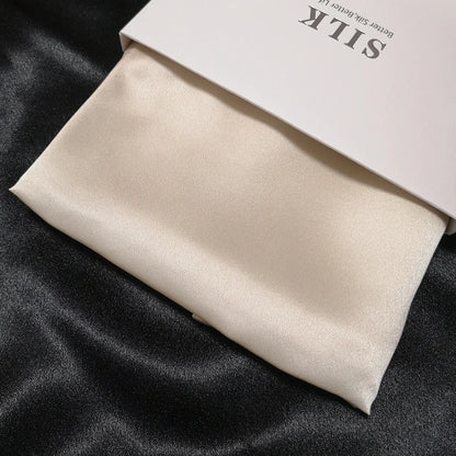 Beige silk fabric on a black background with 'Silk' branding visible.