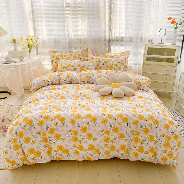 Yellow floral bedding set on a bed in a bright bedroom