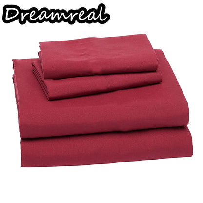 Red bed sheets set with 'Dreamreal' branding on a white background