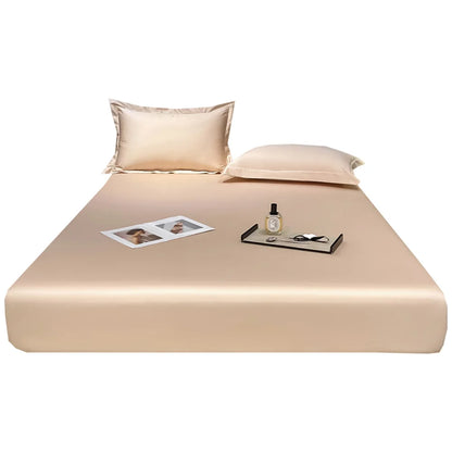 Beige bed sheet set with pillows on a white background
