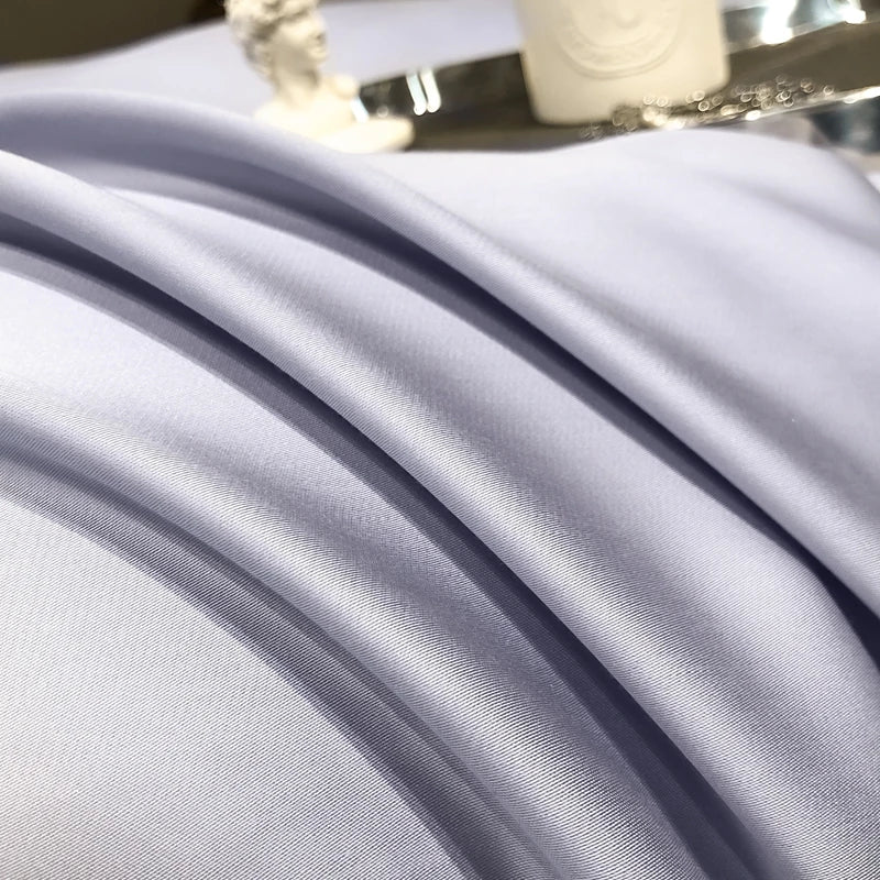 Close-up of Lavander fabric with a decorative item in the background