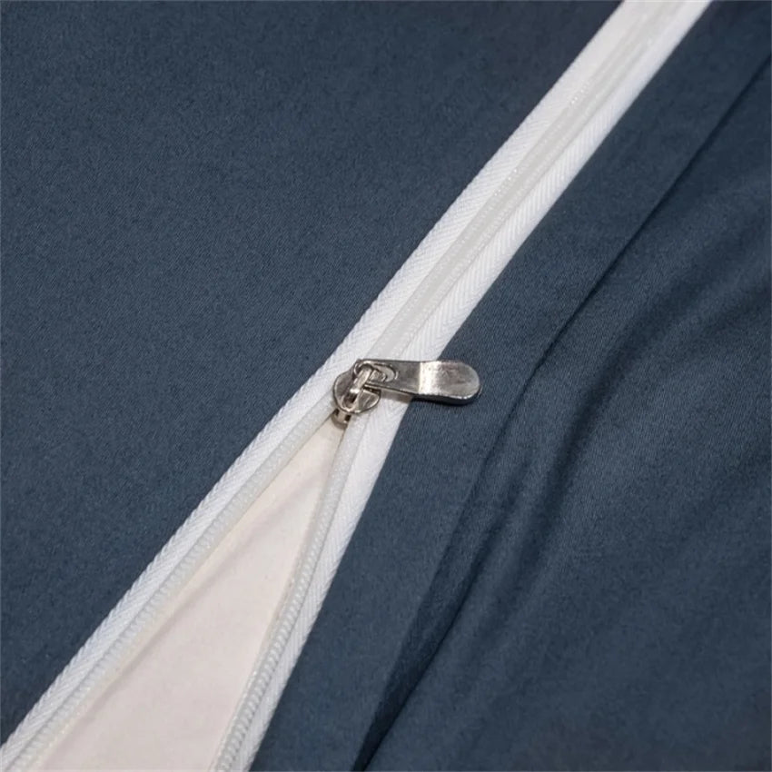 Close-up of a zipper on a blue fabric background