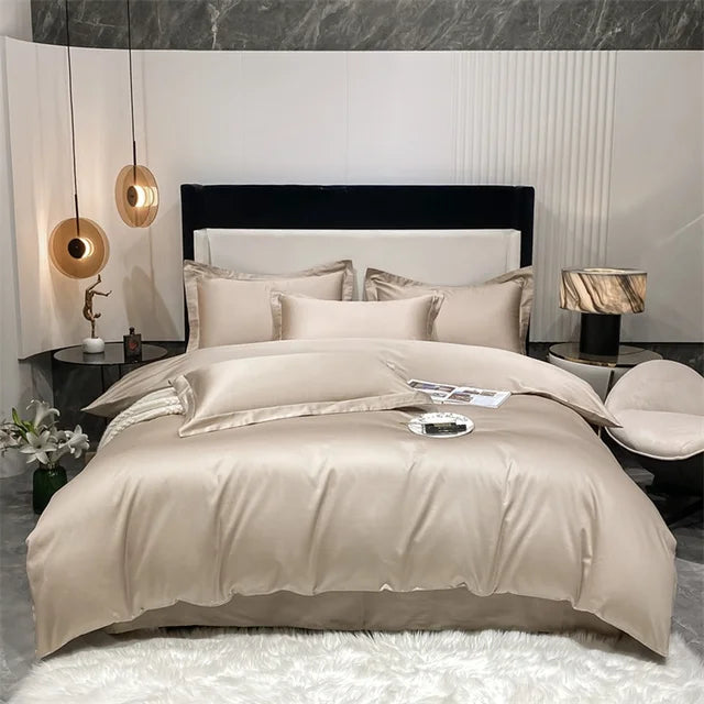 Beige bedding set on a bed in a modern bedroom with marble walls and decorative lamps.