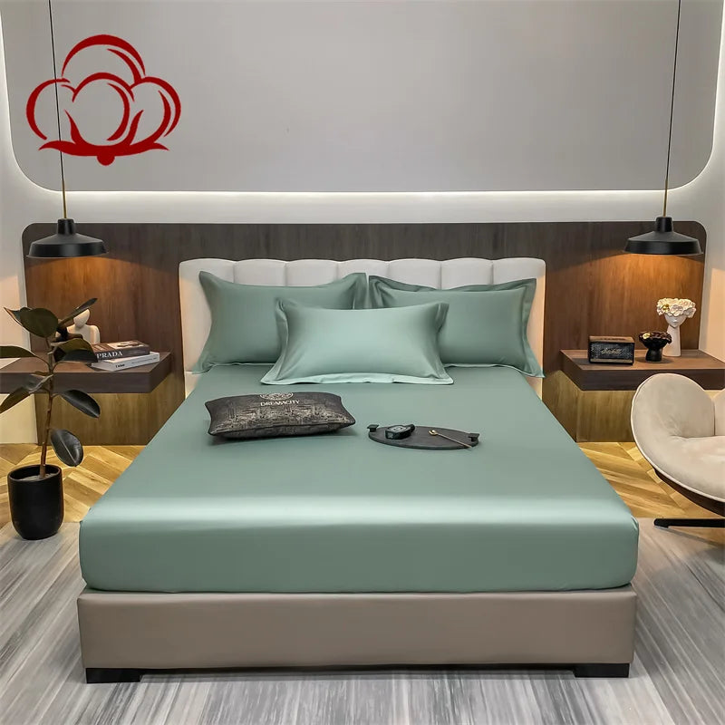 Modern bedroom with a bed and decorative pillows, featuring a brand logo in the corner.