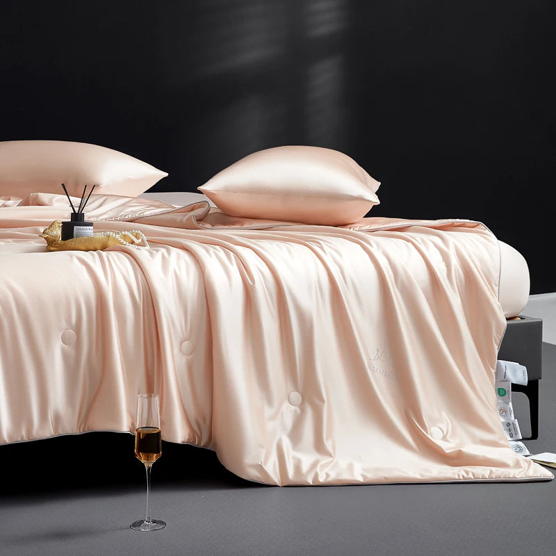 Bed with pink bedding and pillows on a dark background