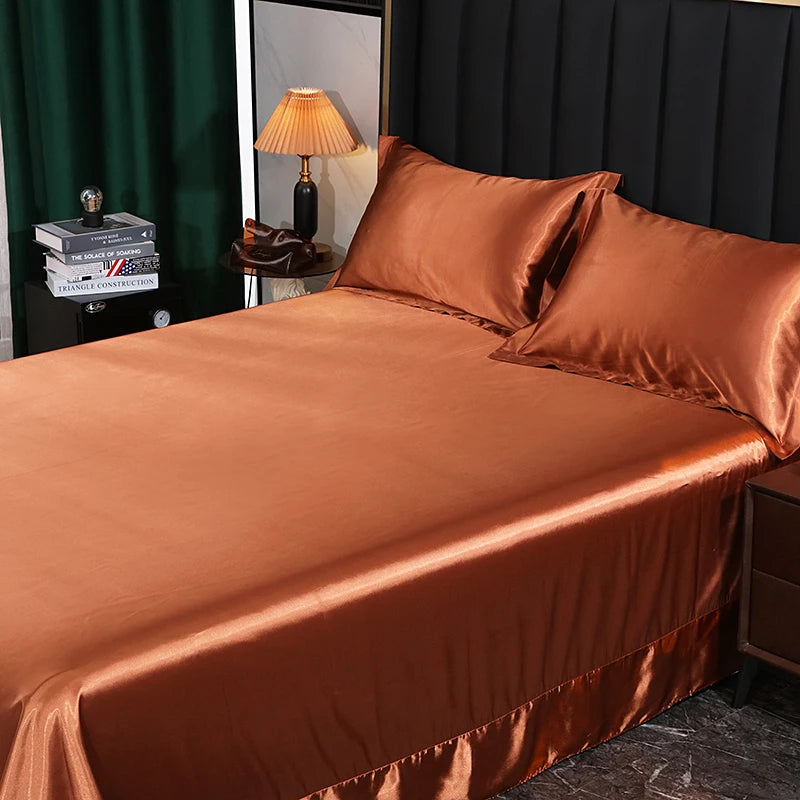 Brown satin bedspread on a bed with a dark headboard and lamp in the background.