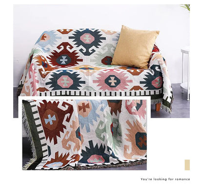Patterned blanket draped over a chair with a pillow, on a white background