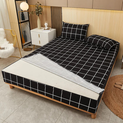 Bed with black and white checkered bedding in a bedroom setting