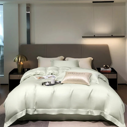 Neatly made bed with white bedding in a modern bedroom setting.