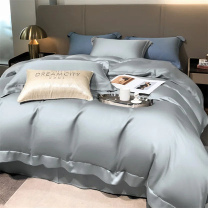 Gray bedding set with pillows and a tray on a bed in a bedroom setting.