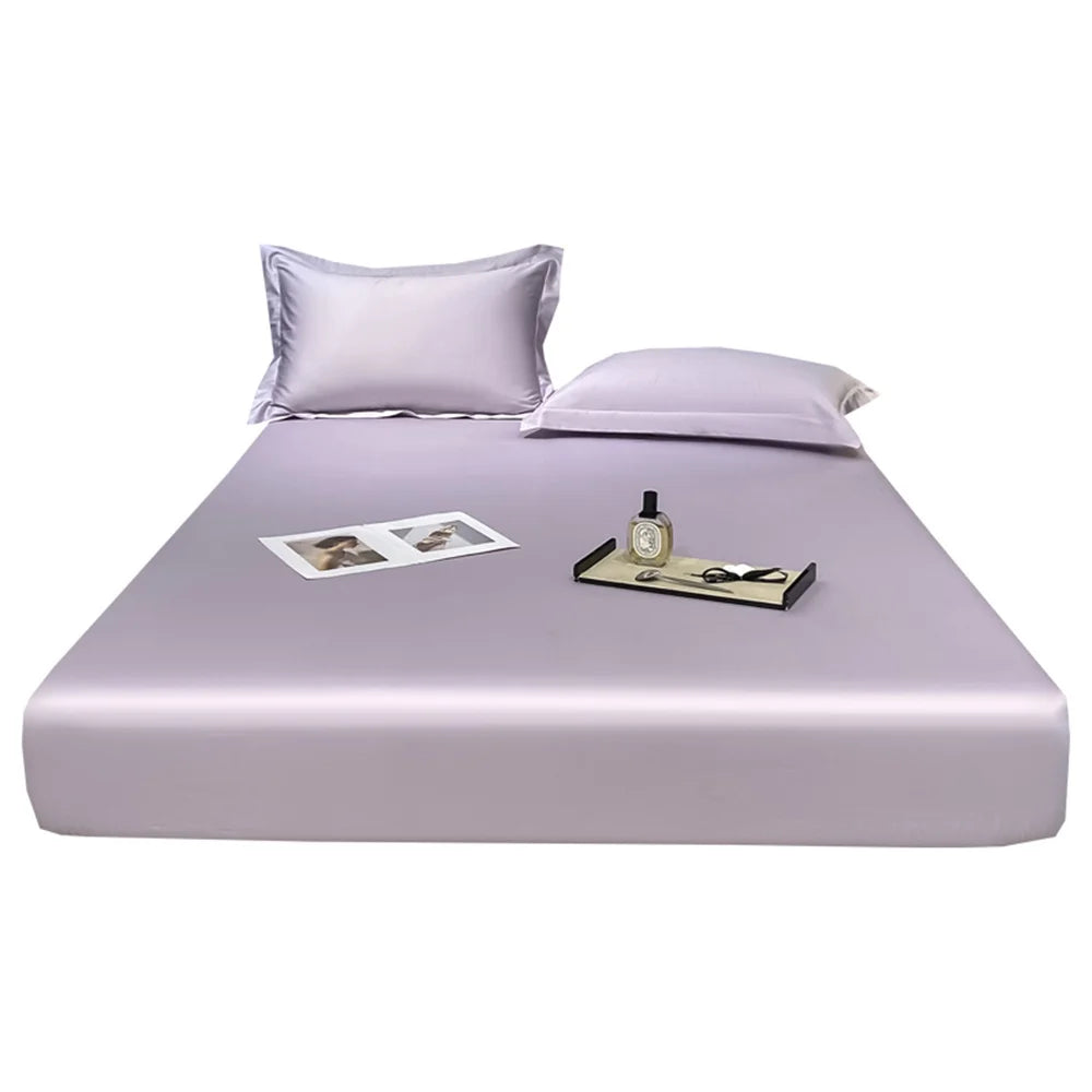 Purple satin sheet set on a bed with a white background